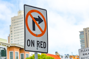 A street sign in San Francisco, California telling drivers that a right turn on a red light is not allowed.