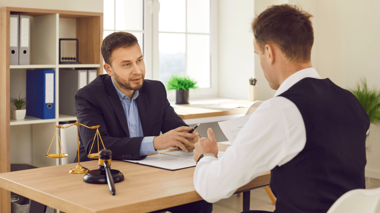 Driver consulting a lawyer about going to court for a speeding ticket