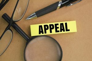 Magnifying glass and appeal tag – what happens when you appeal a suspension