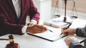 Lawyer consulting with client about court-appointed attorney for reckless driving case