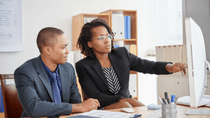 Professionals developing strategies on how to control reckless driving in office setting