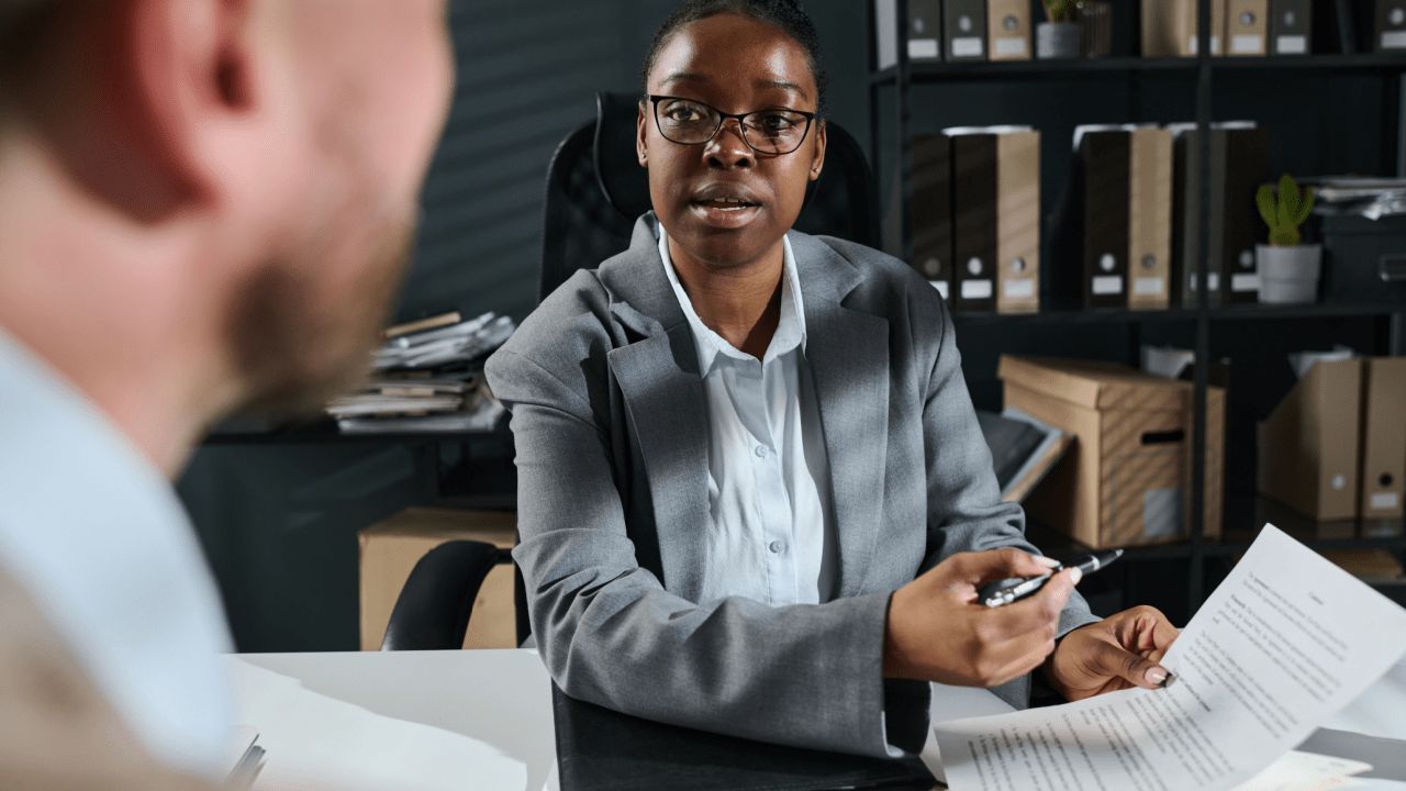 What is the best defense for reckless driving - attorney consulting with client in law office