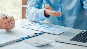 Legal consultation about can I sue someone for reckless driving case with attorney reviewing accident documents and evidence