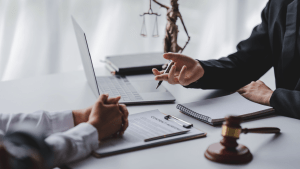Reckless driving lawyer consulting with client in professional law office