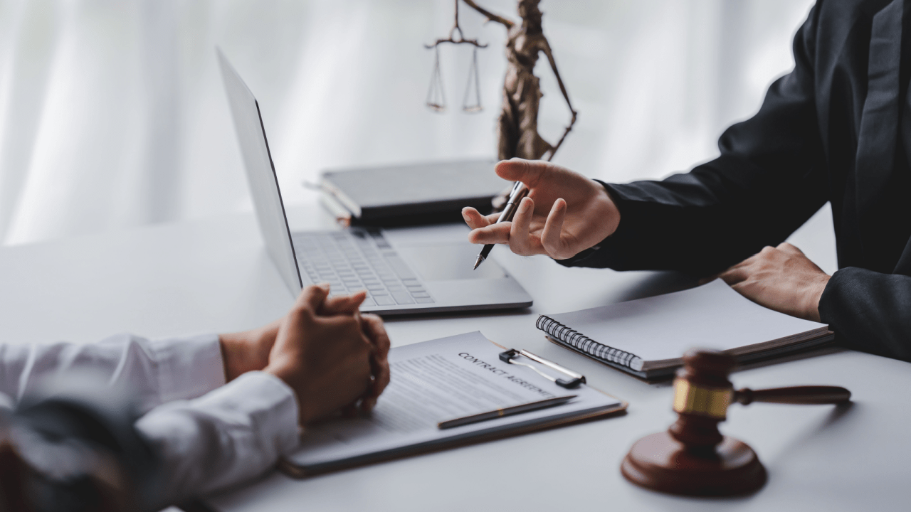 Reckless driving lawyer consulting with client in professional law office