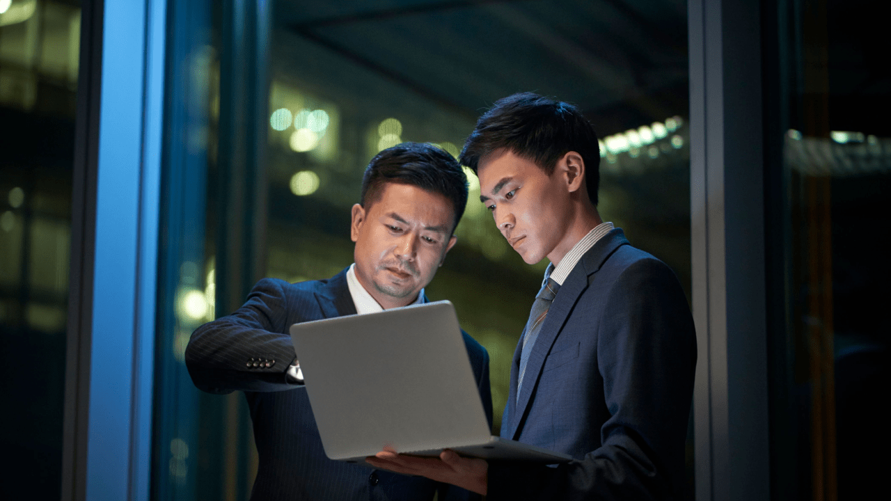 Two professional attorneys working on traffic violation lawyer for minor traffic offenses case review in modern office