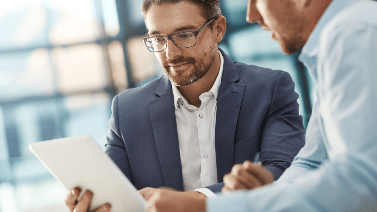 Professional lawyer consulting with client about legal documents, illustrating the benefits of hiring a traffic ticket lawyer for expert representation