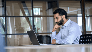 Cellphone use while driving ticket lawyer consulting with client in modern office setting