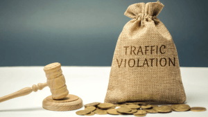 Traffic violation bag with gavel and coins showing how to contest a ticket by mail with lawyer help