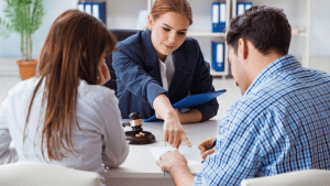Professional consultation showing how to pick a traffic lawyer during client meeting with gavel on desk