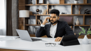 Seat belt violation lawyer speaking with client on phone in professional office