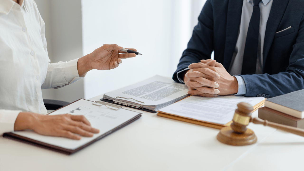 Traffic court arraignment process explained during legal consultation with attorney and client