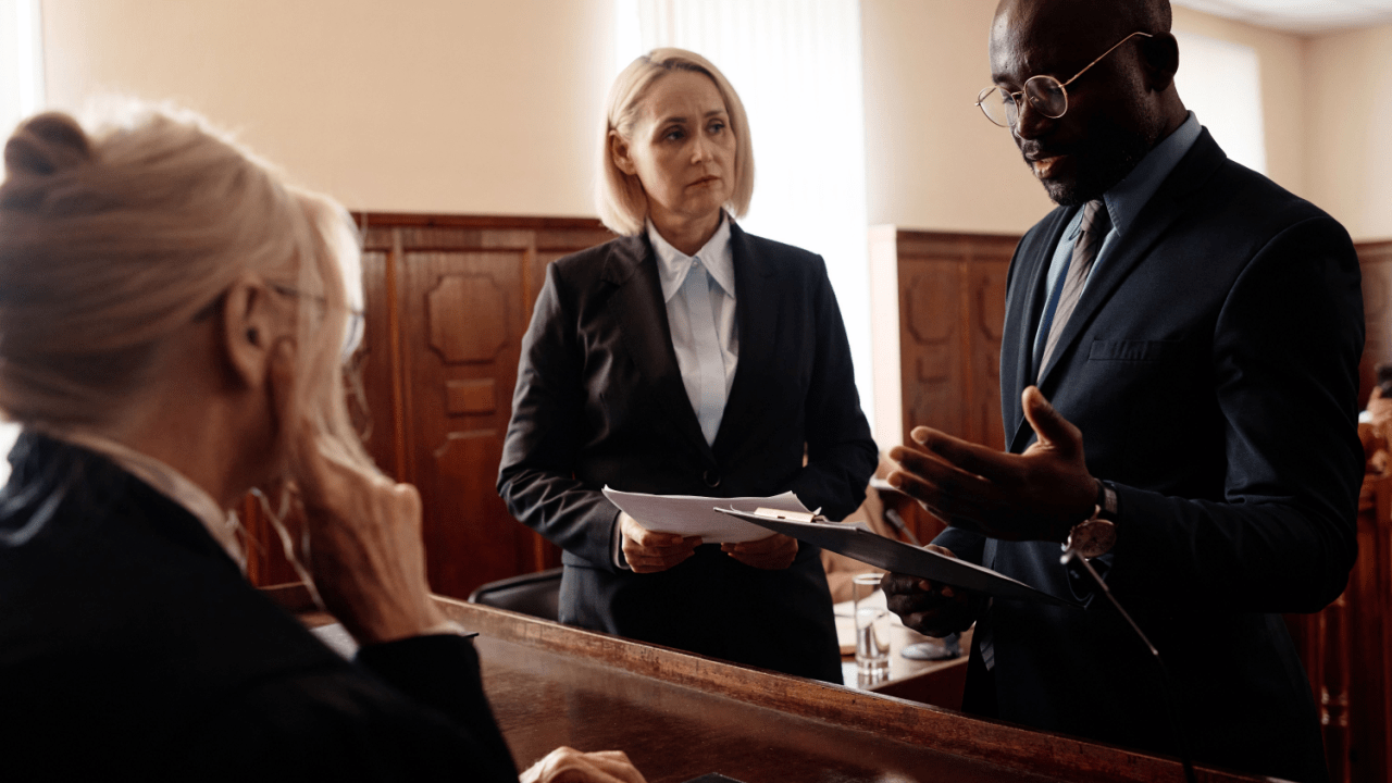 Professional traffic lawyers discussing what does a traffic lawyer do in court during legal proceedings in courtroom