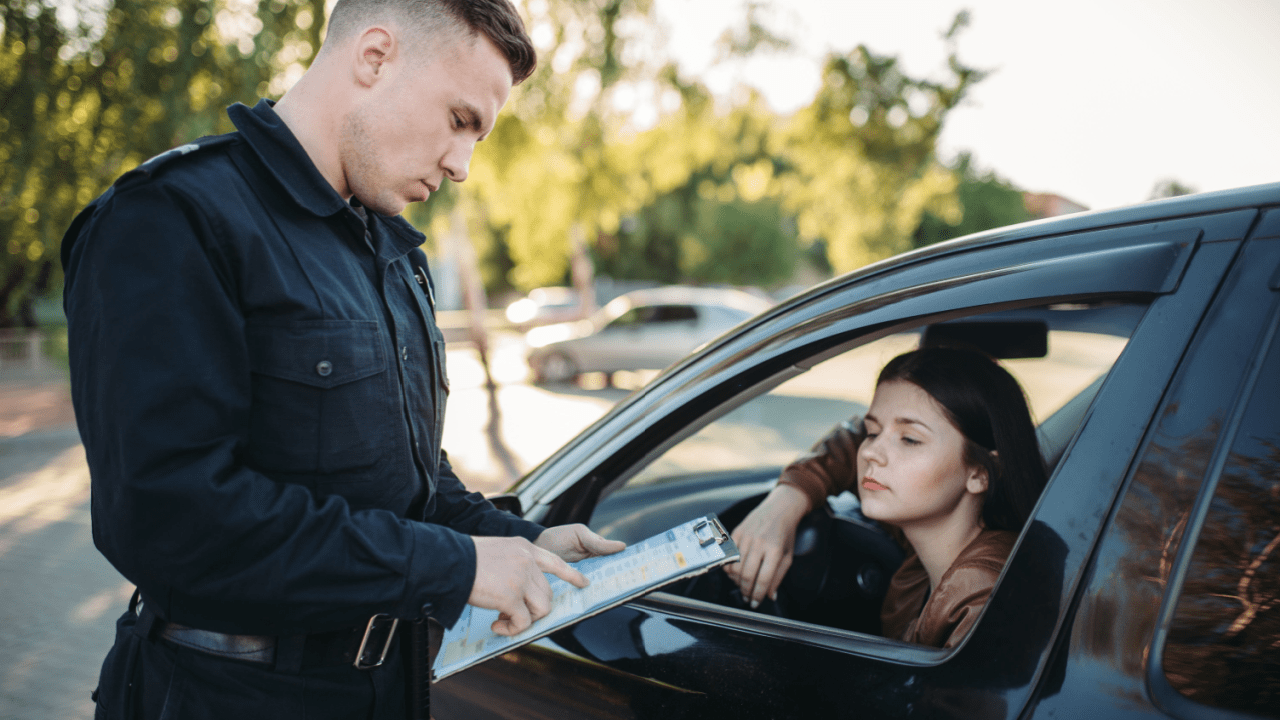 Police officer writing citation for what is the most common traffic violation while driver waits in vehicle