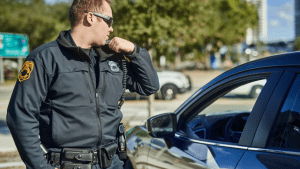 Police officer enforcing traffic laws on private property during traffic stop
