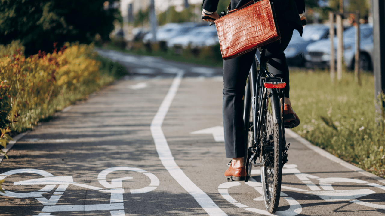 Cyclist riding in designated bike lane showing do bicyclists have to obey traffic laws compliance