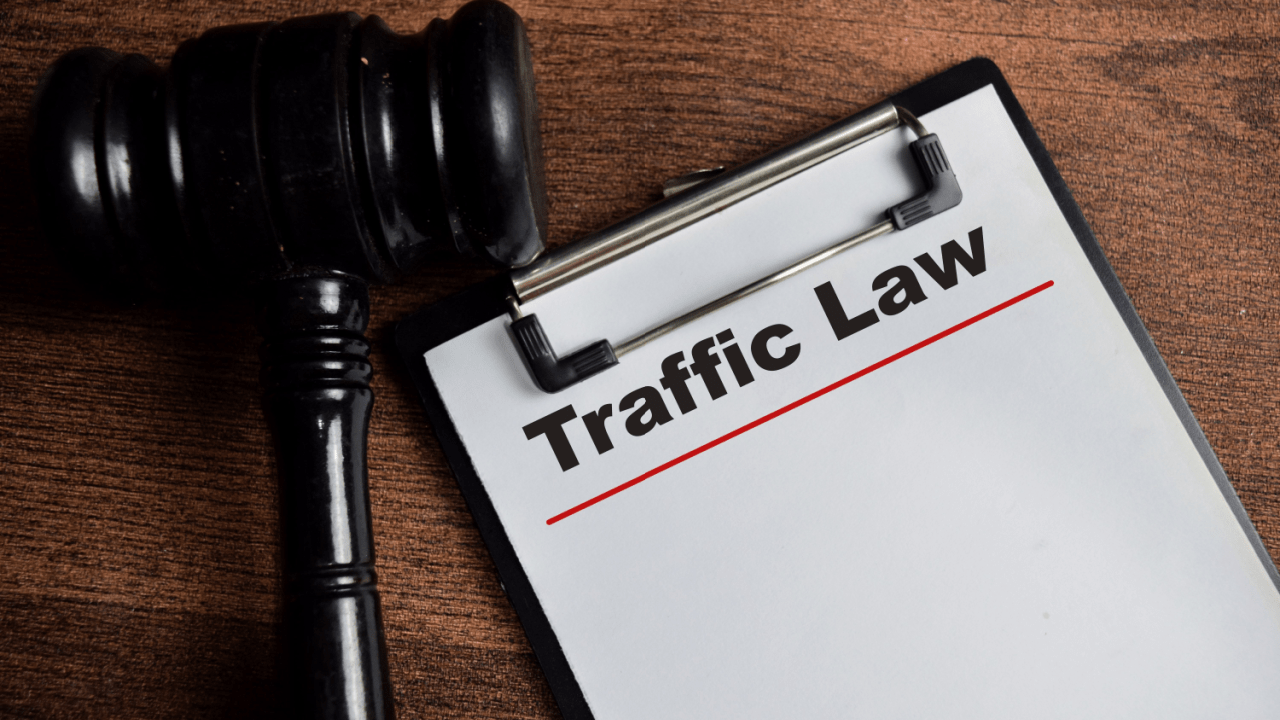 Judge's gavel next to Traffic Law clipboard representing specialized traffic lawyer cases requiring expert legal representation