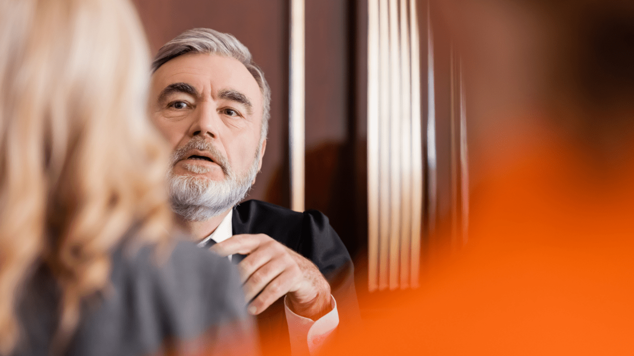Judge listening to defendant ask to reduce a ticket in traffic court hearing