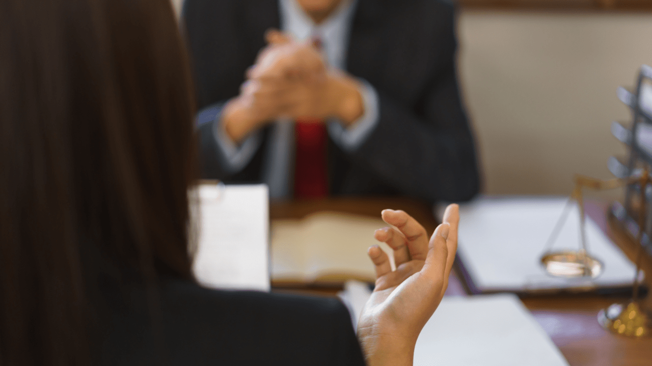 Traffic court defendant learning how to beat speeding tickets in court with legal representation