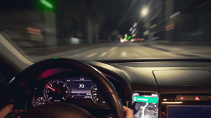 How to explain speeding in court dashboard view showing speedometer at night while driving