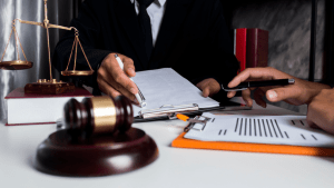 Attorney consultation discussing what is the best excuse for a speeding ticket with legal documentation and defense strategy review