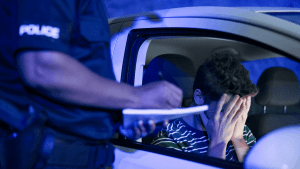 DOT officer pulling over driver during traffic stop for vehicle inspection and citation