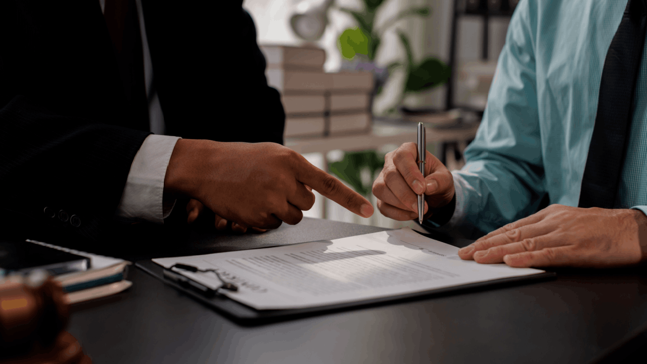 Commercial drivers traffic ticket consultation with lawyer reviewing legal documents and defense options