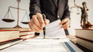 CDL ticket defense discount lawyer reviewing traffic violation documents with scales of justice