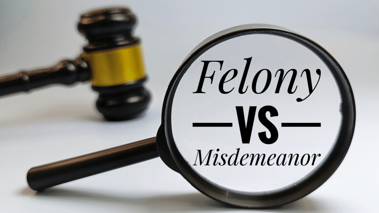 Magnifying glass examining felony vs misdemeanor DUI under state laws with gavel in background