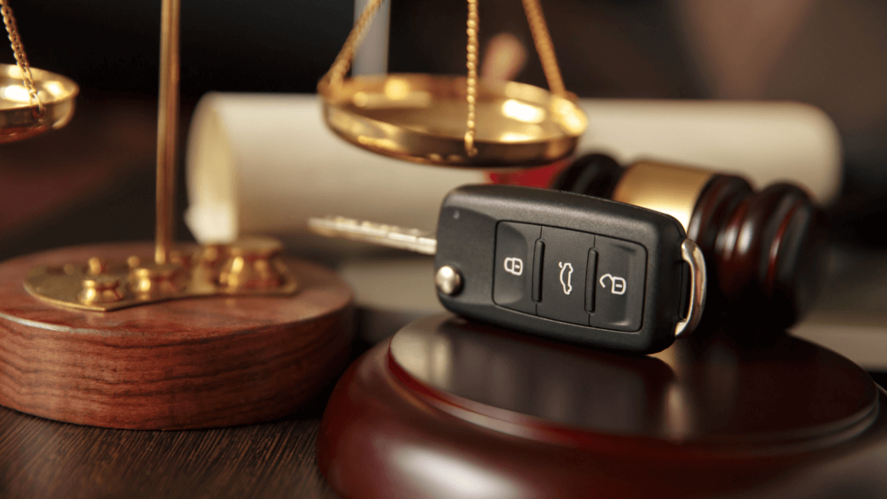 Car keys on gavel symbolizing state DUI law variations with scales of justice in background