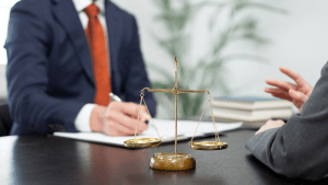 Legal professionals discussing DUI legality and drinking rules in all states with scales of justice