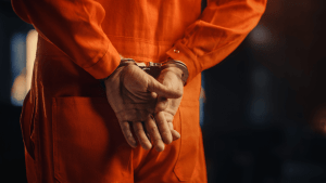is careless driving a felony handcuffed defendant in orange jumpsuit