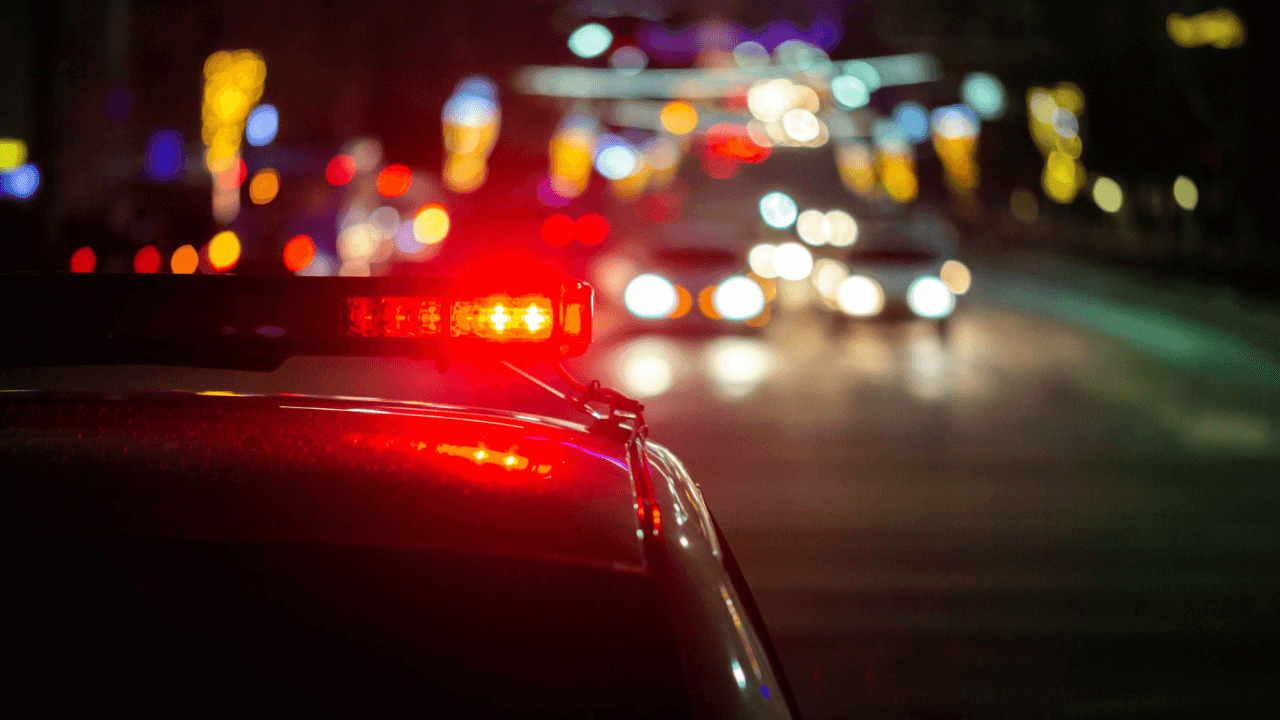 Police vehicle lights at night illustrating which states do not allow DUI checkpoints